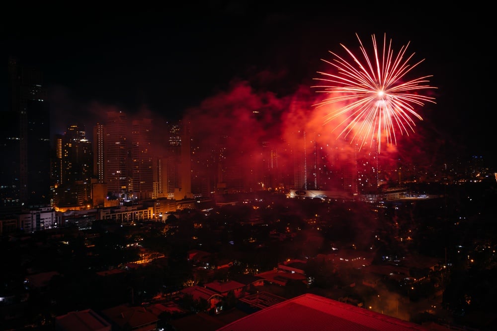 Chinese New Year fireworks over Makati at night, in Metro Manila, The Philippines..jpeg