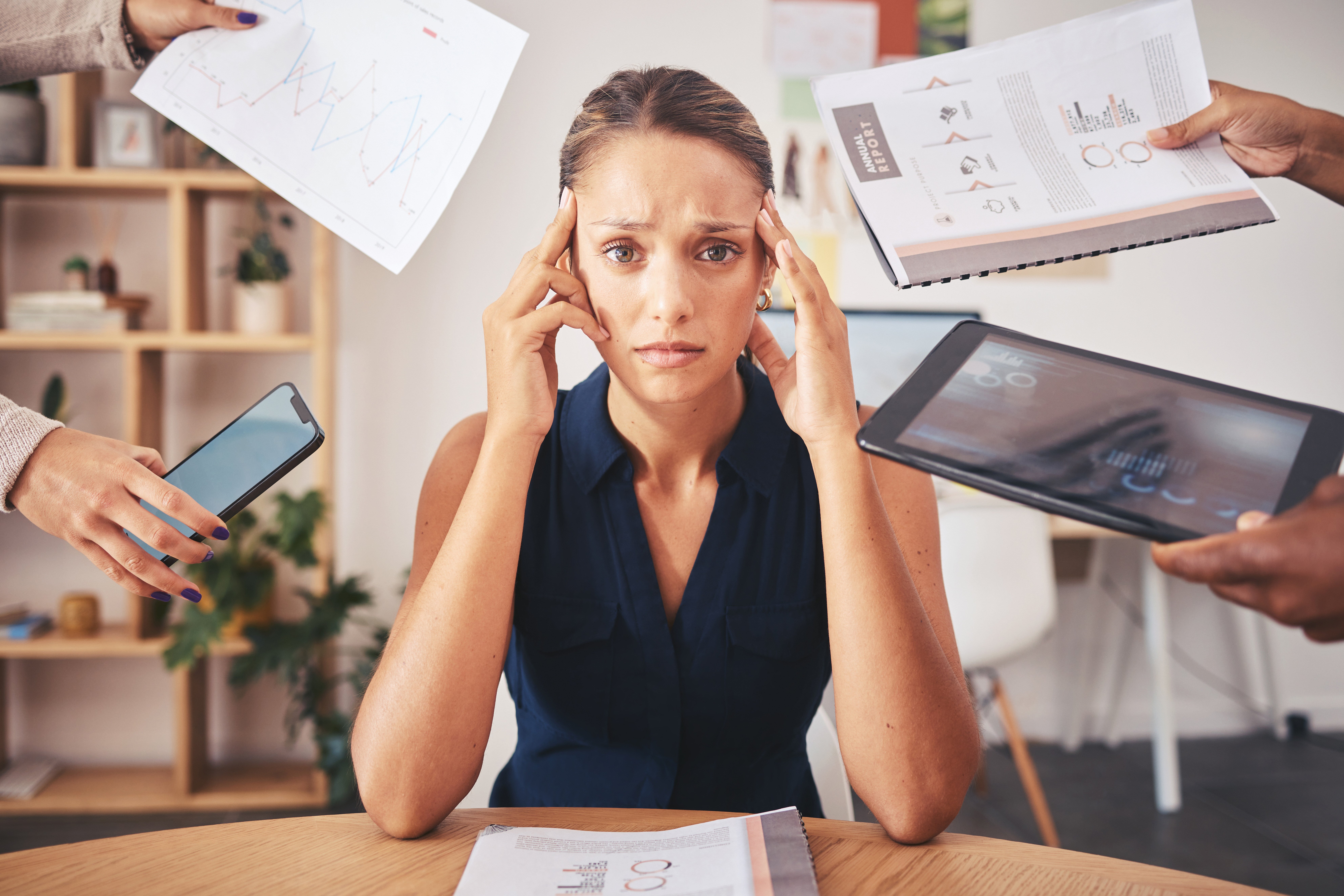 Woman is overwhelmed while multi-tasking