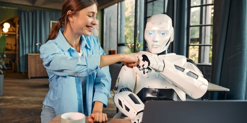 Woman works with Ai robot assistant in the office